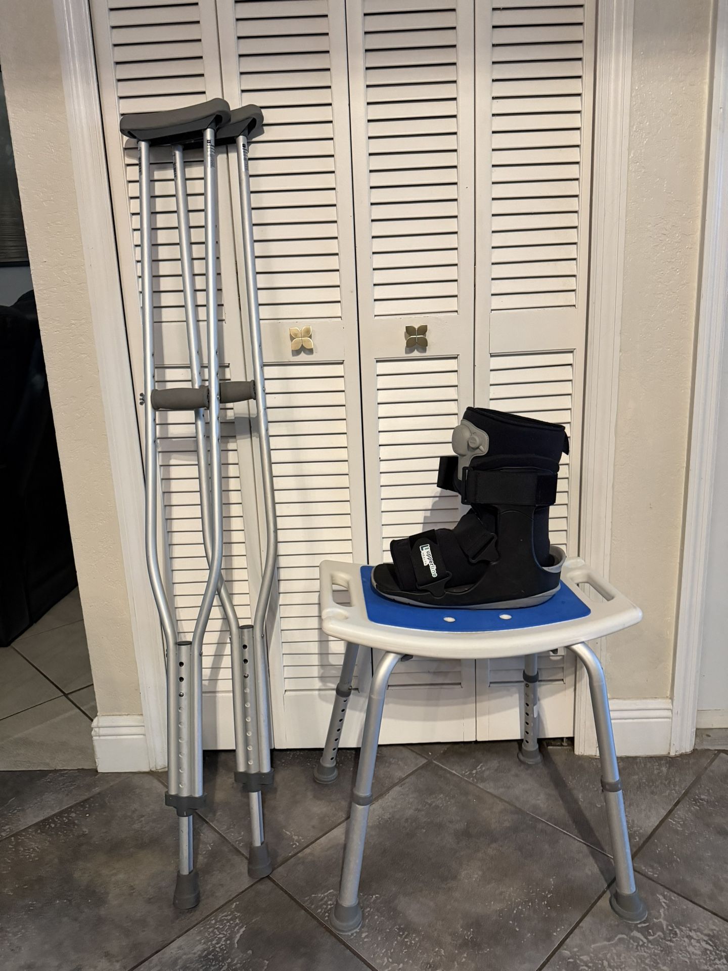 Crutches, Large Walking Boot, And Bathing Seat