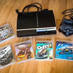 PlayStation 3 + 2 Controllers + Charging Dock + 7 Games + Remote