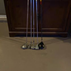 Golf Clubs( Ping 2 Iron, Taylor Made R7 driver, Northwestern And Henry Griffitts Retro 3 Woods, Mercury 11 Degree Wood)