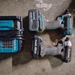 Two Makita Impact Drills And Charger