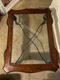 Wood and glass coffee table with wrought iron base