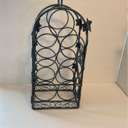 Heavy metal wine rack. Holds seven bottles