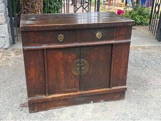 Antique, Chinese Elmwood sideboard cabinet brass face plate and two drawers circa 1880 to 1920