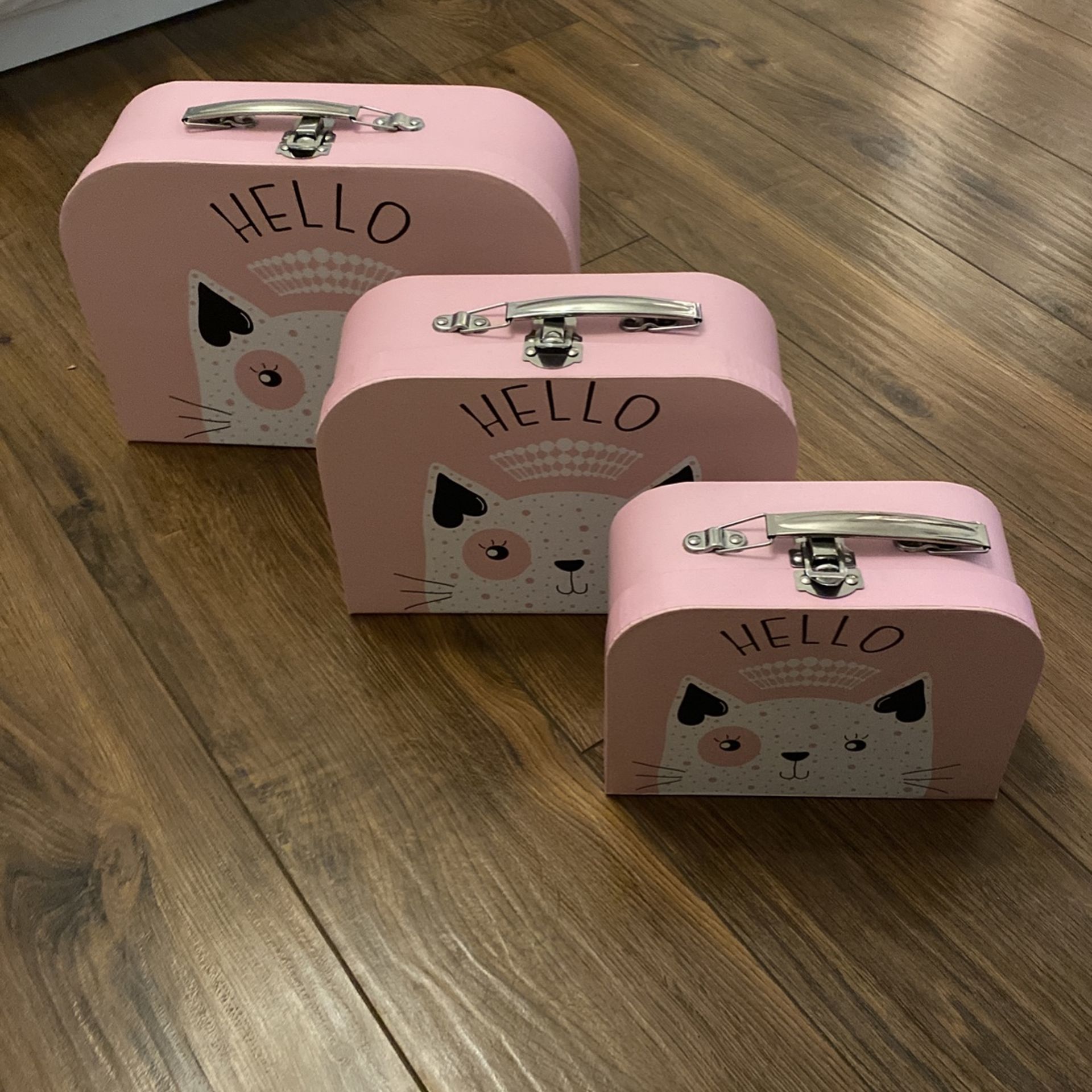set of three pink boxes