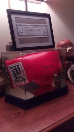 Authentic hand sighed Muhammad Ali boxing glove in mirrored display case with certificate of authenticity