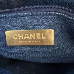 This is an authentic CHANEL Denim Quilted Mini Pearl Crush Rectangular Flap in Blue. The chic mini crossbody bag is crafted in soft quilted blue denim