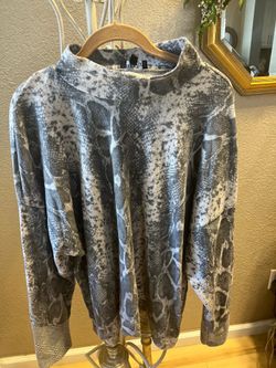 Open turtleneck, snake print top