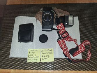 Canon T70 with a speedlite and zoom lens. Also strap and case. All sales final.