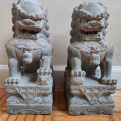 solid stone hand carved sandstone foo Dogs With rotatable but non removable stone ball in mouth Each is unique and hand carved.  Hand carved in china 