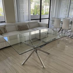 Glass dining room table with stainless steal base 