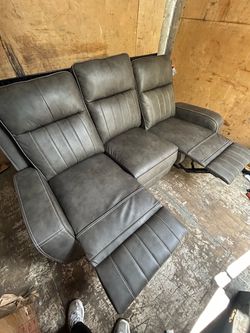 Gray Leather Reclining Sofa with Footrests