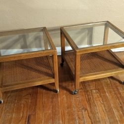 Vintage Mid Century Pair of Walnut Side End Lamp Tables Accented With Faux Cane Bottoms, Tempered Glass Tops and Original Casters