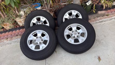 Set up for Tires for any Toyota six logs they all have center caps no lug nuts. They all in super conditions 60% left if not more tread. Set up for Ti