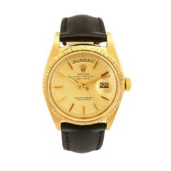 Rolex Day-Date 36mm Pre-owned Rolex Day-Date. Has a yellow gold 36mm case and black leather strap. Features a yellow gold bark finish bezel and a fact