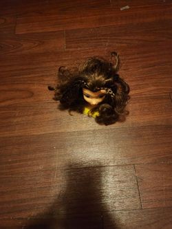Doll Head with Dark Curly Hair