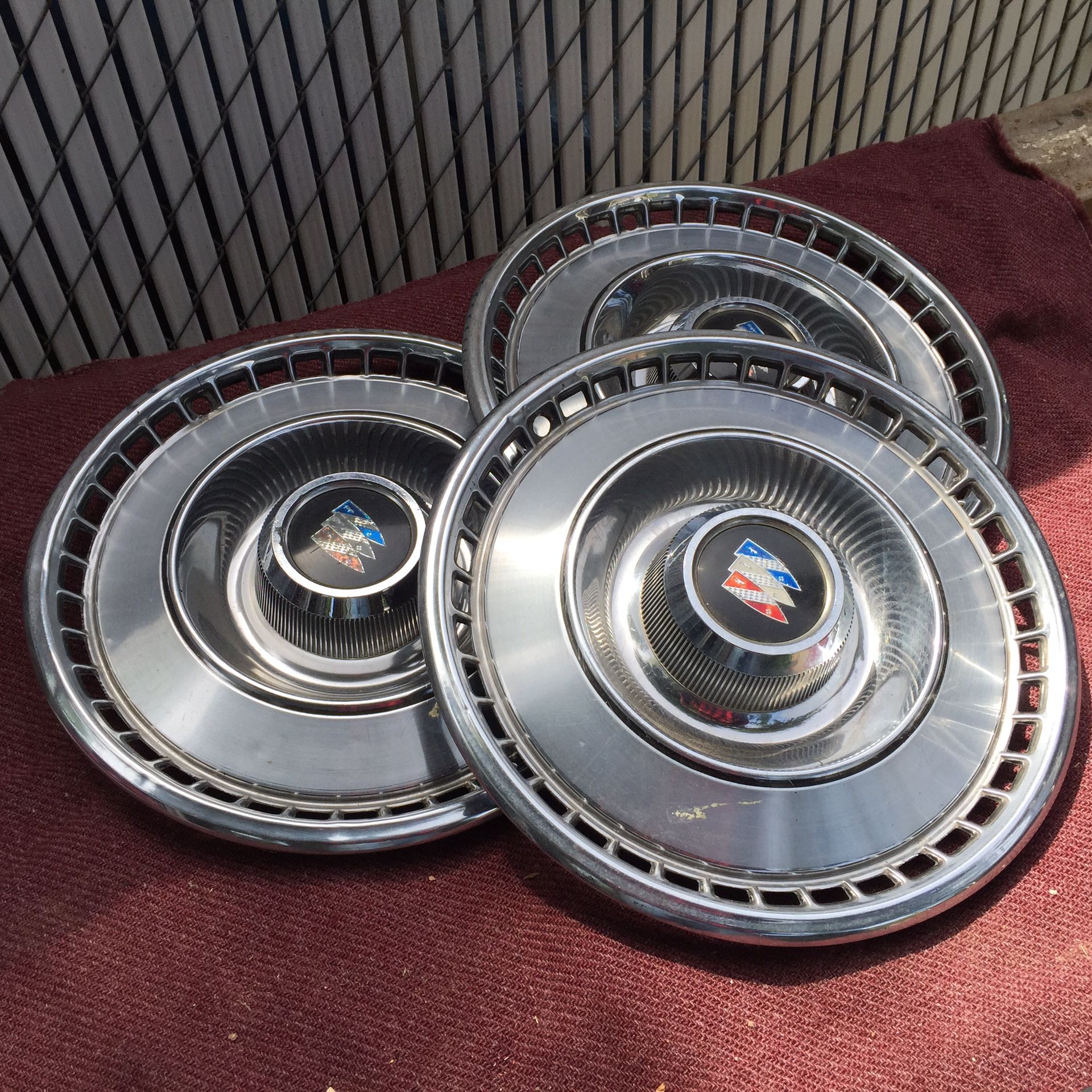 1965 Buick Wildcat hubcaps (3)