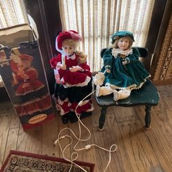 Two Beautiful Antique Musical Holiday Dolls.  Both Move When Turned On.