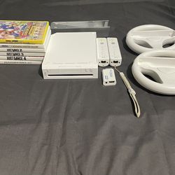 Nintendo Wii Consoles - 6 Games & Two Controllers + Wheels