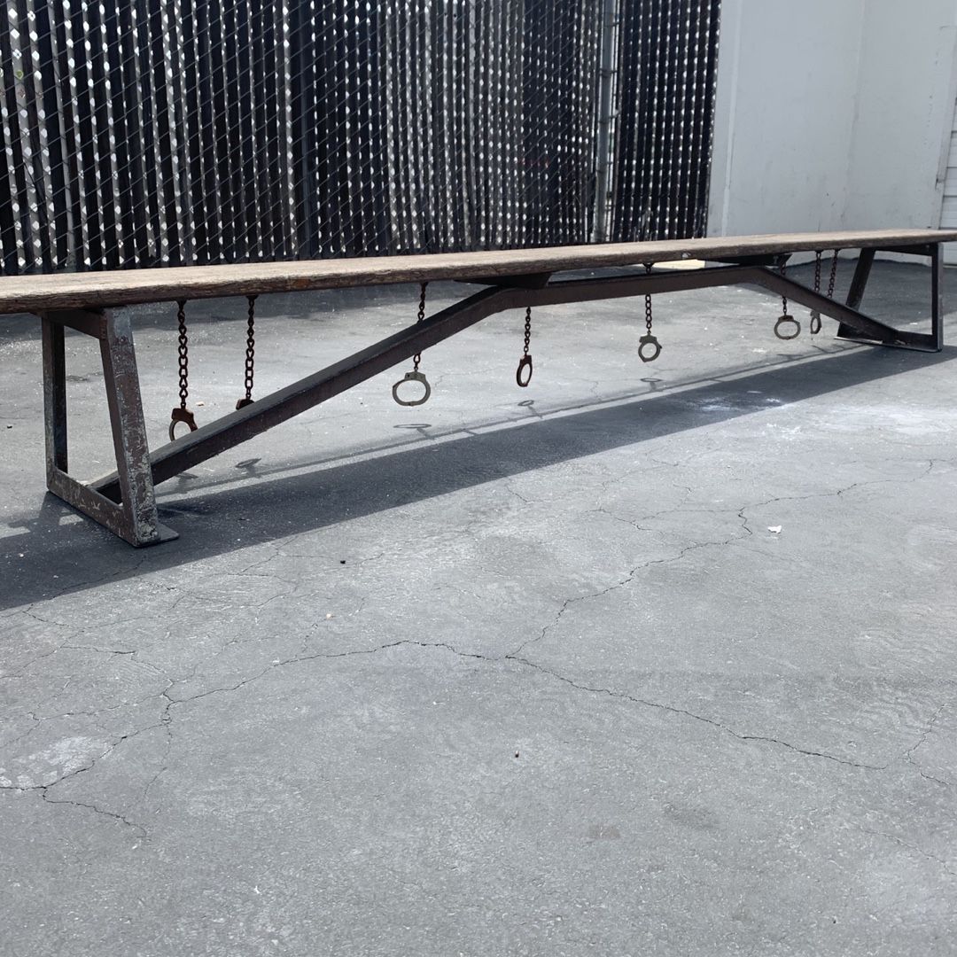 Chain gang bench with handcuffs