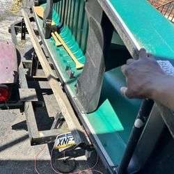 Boat With Trailer And Trolling Motor Also Has Paddles 