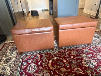 Two matching faux caramel leather ottomans