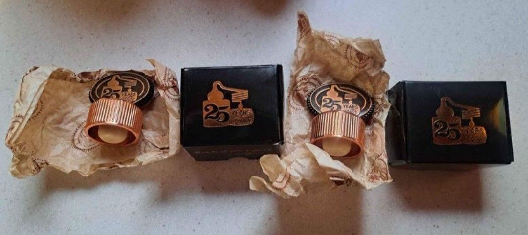 Two Tito's Handmade Vodka 25th Anniversary Metal Bottle Toppers