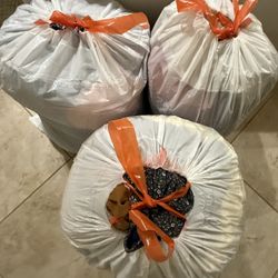 3 Bags of mystery clothes (different variety)