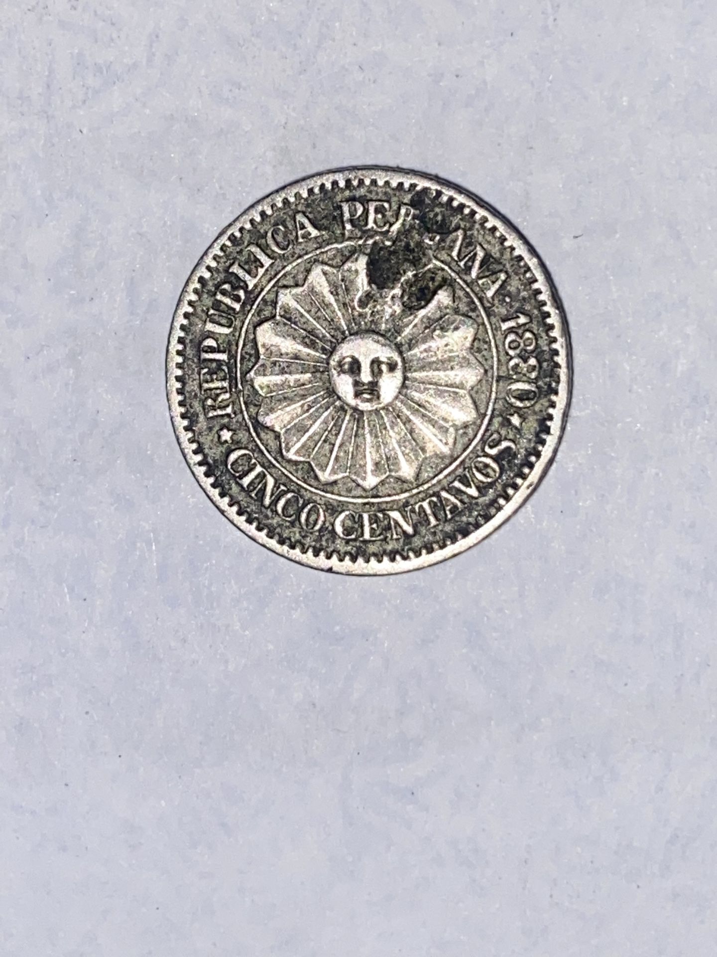 The product is a 5 centavos coin from Peru, minted in 1880. This coin has historical significance as it represents a piece of currency from a specifi