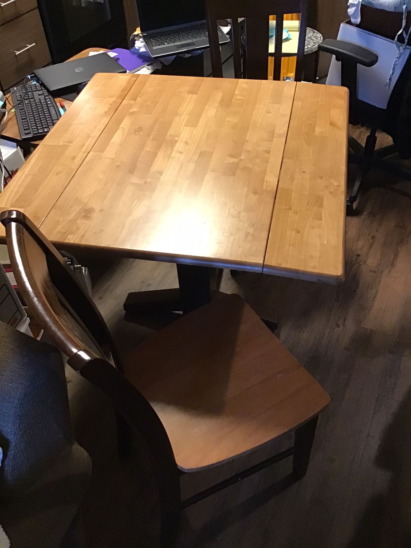 Small kitchen table and two chairs. Wood