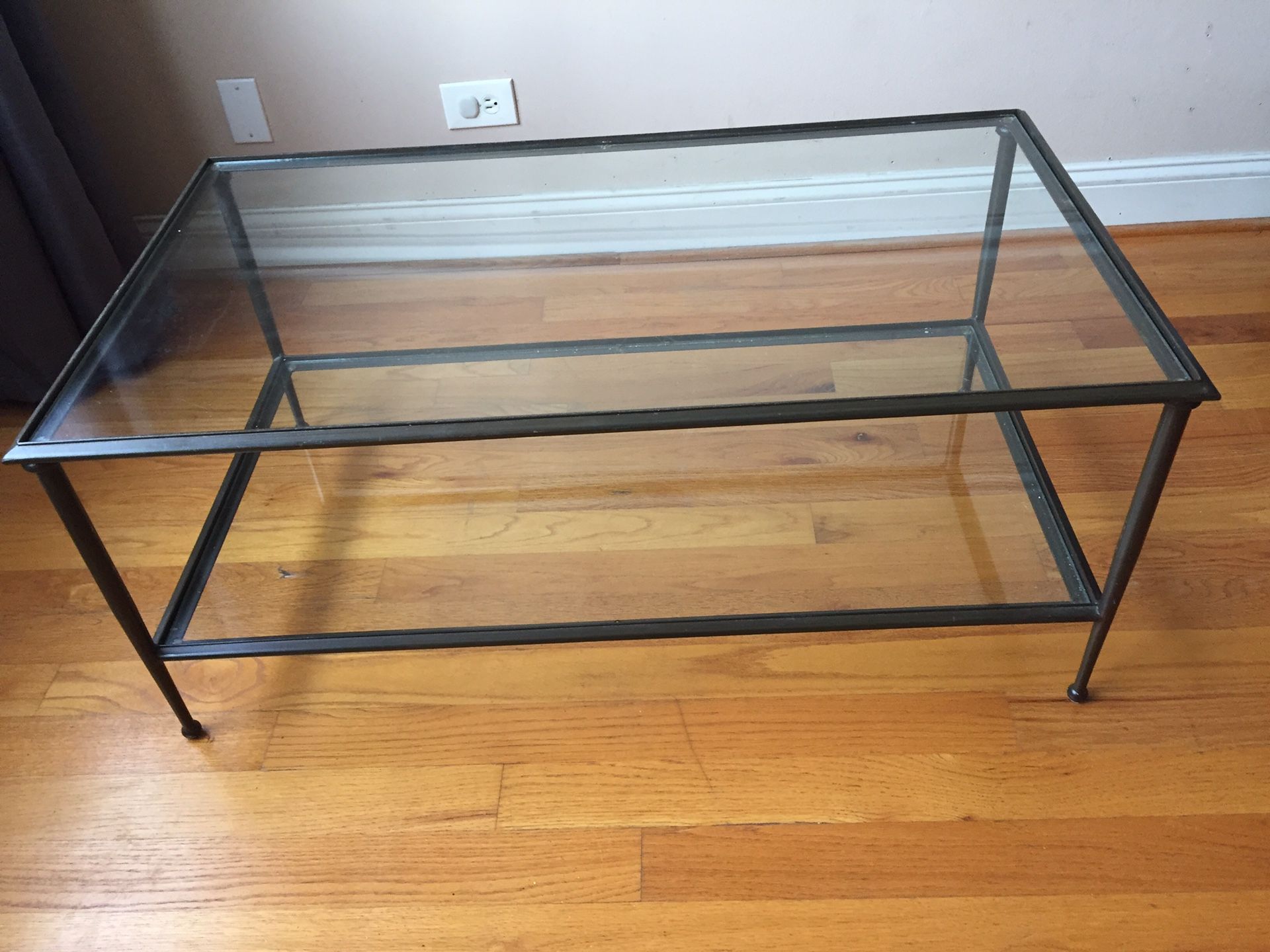 Two tier black framed glass coffee table 
