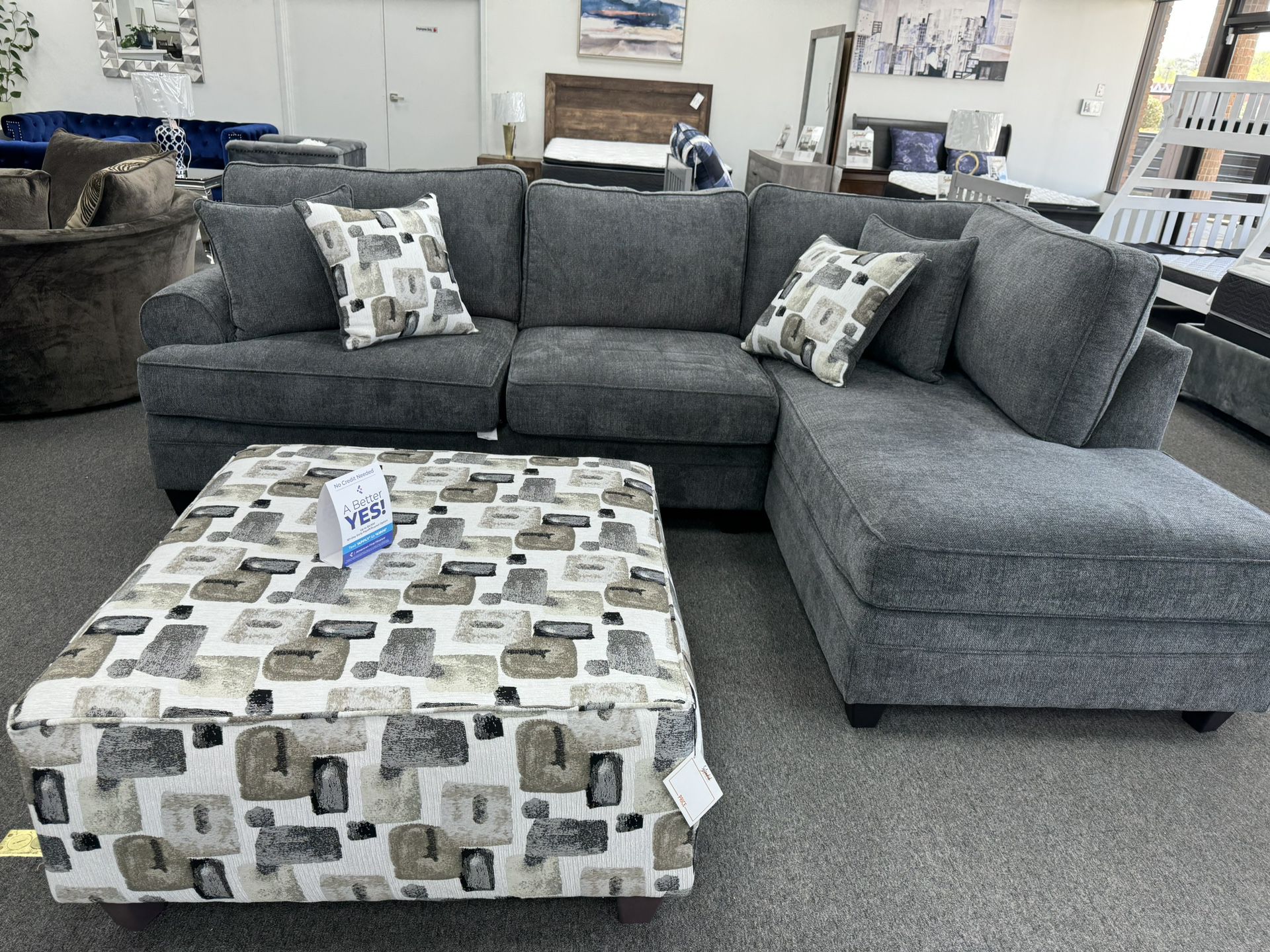 Sectional With Patterned Toss Cushions And Matching Ottoman On Promotion