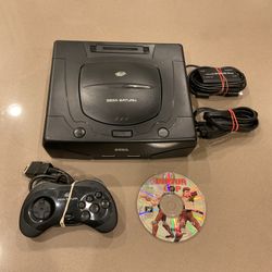 Sega Saturn console and game