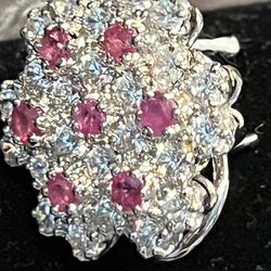 “New diamond-style handmade stud earrings. Very hard to find. Made with 925 sterling silver, real ruby, and cubic zirconia.”