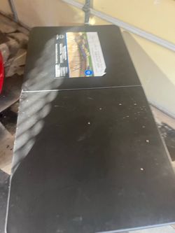 Never used 4 foot adjustable foldable table