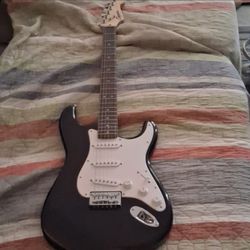 Squire black and white Electric guitar and speaker bundle