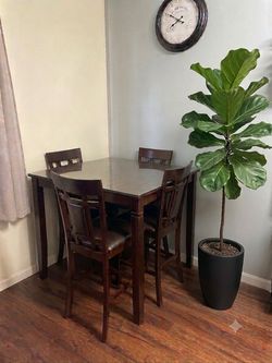 Table with glass and four chairs