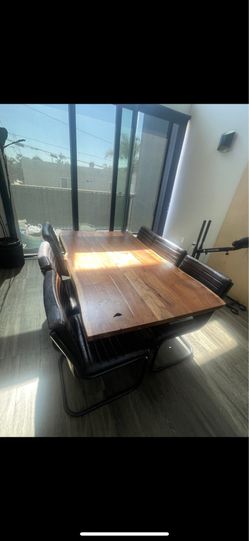 Wood table and leather chairs