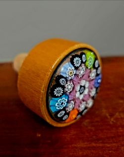 Handmade decorative bottle stopper featuring a colorful floral millefiori Cork