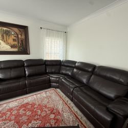 Leather Sectional Recliner Sofas With 2 Recliners and A Coffee Table and Two End Tables 