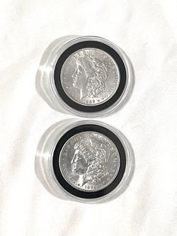 About uncirculated sealed in capsules 1889 and 1890 Morgan silver dollars. These are valued at $100 each on US Coin book.