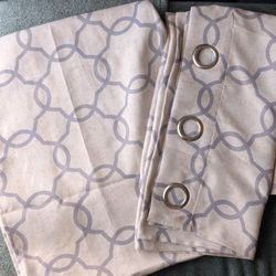 Set of Blackout Curtains in Beige with cool Patterns in a light grey