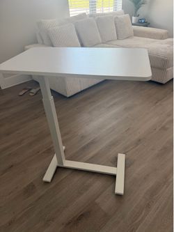 Adjustable table/desk practically brand new