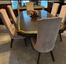 Beautiful Custom formal dining room table with matching chairs. Includes 2 extension leaves.