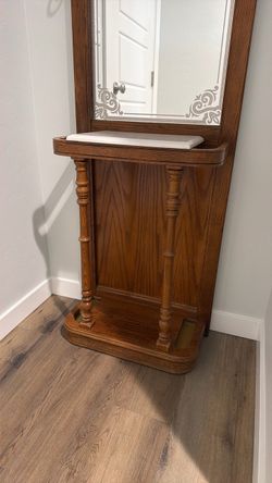 vintage solid oak hall tree with a marble top surface