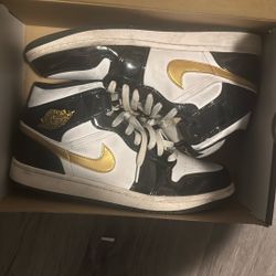 Jordan 1 mid patent black gold
