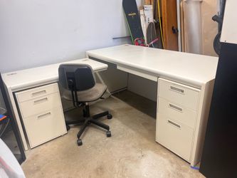White L-shaped office desk with chair