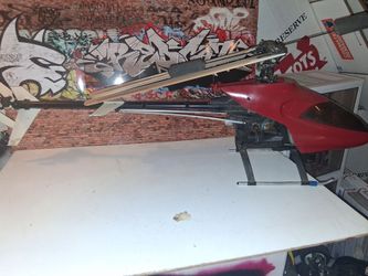 Rc big rc nitro helicopter.  Has remote can of fuel  & starter