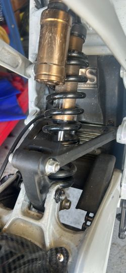 Triangle and linkage surron