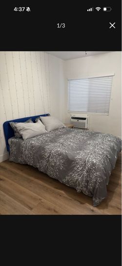 Royal blue queen bed with mattress