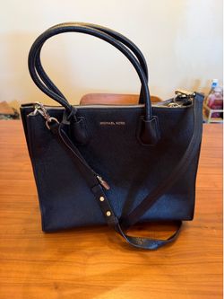 Black Michael Kors handbag with dust bag